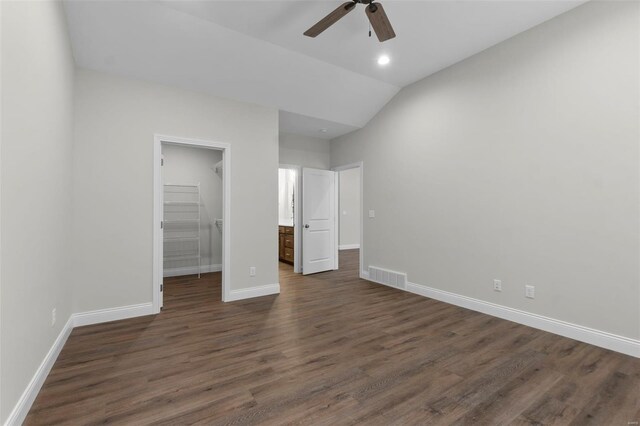 16 Creekside Way, Cape Girardeau, MO 63701 - unfurnished bedroom featuring a walk in closet, baseboards, dark wood finished floors, a closet, and vaulted ceiling