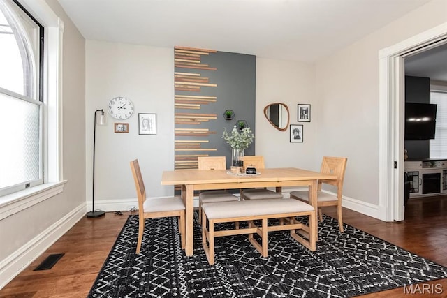 2712 Potomac St, Saint Louis, MO 63118 - dining space with dark wood-style flooring and baseboards
