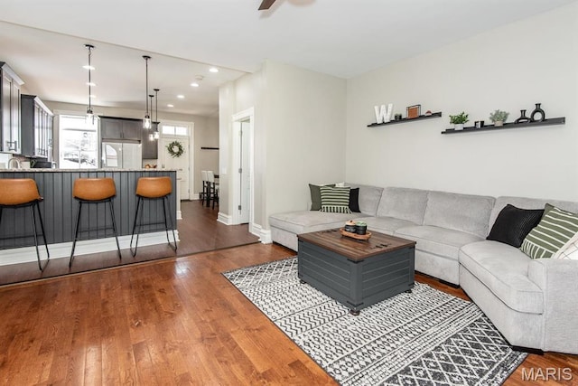 2712 Potomac St, Saint Louis, MO 63118 - living area with wood finished floors, recessed lighting, a ceiling fan, and baseboards