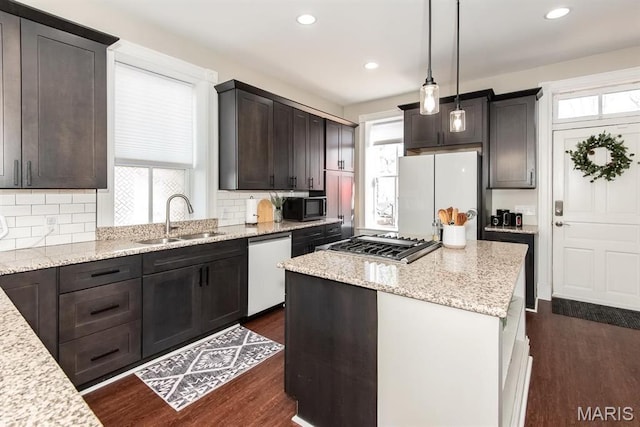 2712 Potomac St, Saint Louis, MO 63118 - kitchen featuring a sink, freestanding refrigerator, dishwashing machine, healthy amount of natural light, and recessed lighting