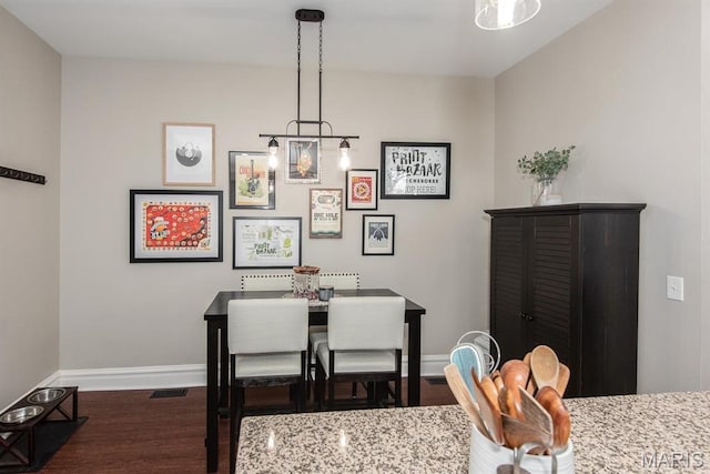 2712 Potomac St, Saint Louis, MO 63118 - dining area with wood finished floors and baseboards