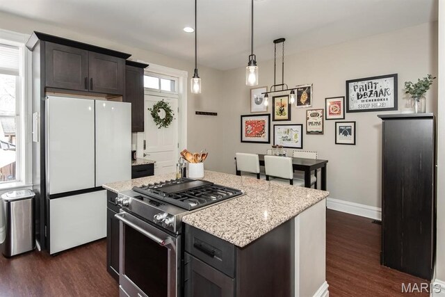2712 Potomac St, Saint Louis, MO 63118 - kitchen with freestanding refrigerator, high end stainless steel range, dark wood-style flooring, baseboards, and recessed lighting