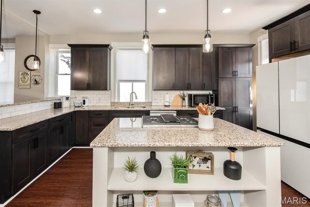 2712 Potomac St, Saint Louis, MO 63118 - kitchen with freestanding refrigerator, dark brown cabinetry, backsplash, a sink, and recessed lighting