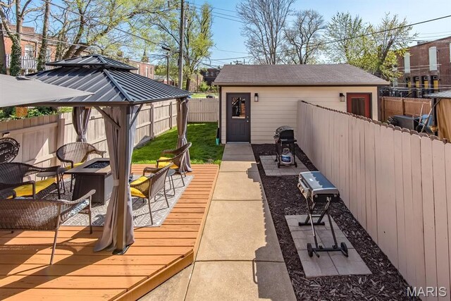 2712 Potomac St, Saint Louis, MO 63118 - view of patio / terrace featuring a fire pit, a fenced backyard, a gazebo, and a deck