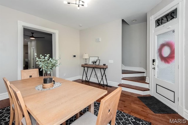 2712 Potomac St, Saint Louis, MO 63118 - dining area featuring wood finished floors, baseboards, and stairway
