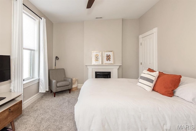 2712 Potomac St, Saint Louis, MO 63118 - bedroom featuring carpet flooring, a fireplace, baseboards, and ceiling fan