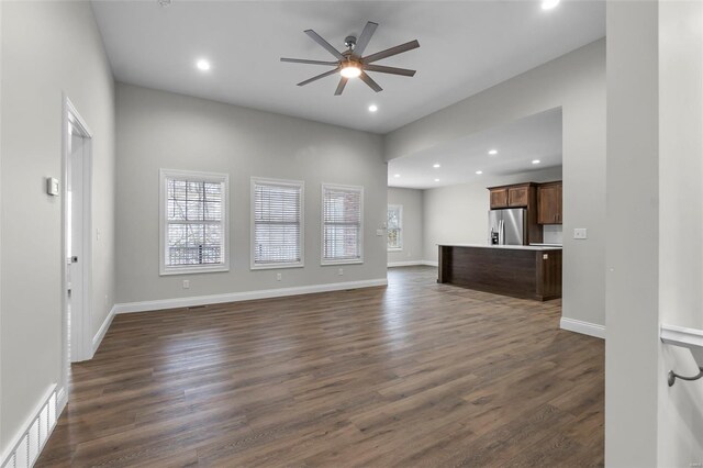 12 Creekside Way, Cape Girardeau, MO 63701 - unfurnished living room featuring healthy amount of natural light, ceiling fan, recessed lighting, dark wood finished floors, and baseboards
