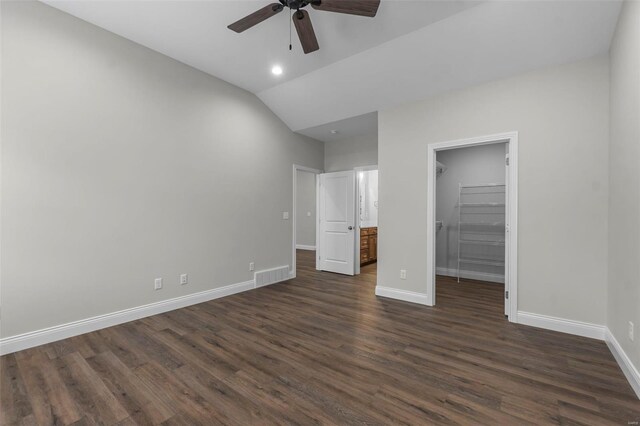 12 Creekside Way, Cape Girardeau, MO 63701 - unfurnished bedroom with a walk in closet, dark wood finished floors, baseboards, lofted ceiling, and a closet