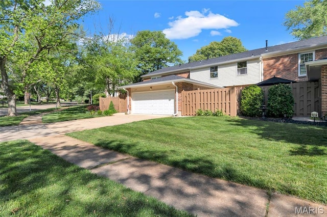 13355 Land O Woods Dr, Saint Louis, MO 63141 - view of front facade featuring brick siding, an attached garage, and driveway