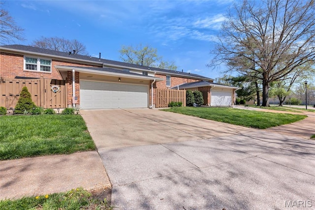13355 Land O Woods Dr, Saint Louis, MO 63141 - split level home with brick siding, driveway, and an attached garage