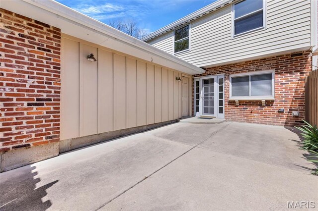 13355 Land O Woods Dr, Saint Louis, MO 63141 - property entrance featuring brick siding and a patio
