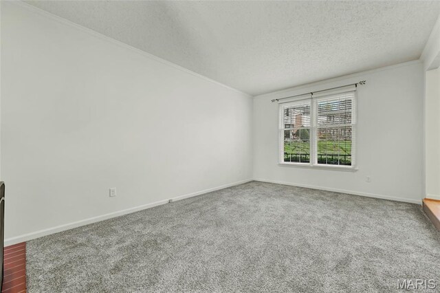 13355 Land O Woods Dr, Saint Louis, MO 63141 - empty room featuring a textured ceiling, crown molding, carpet floors, and baseboards