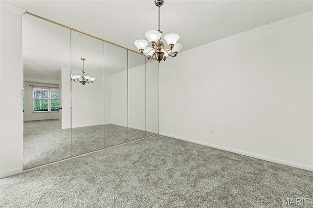 13355 Land O Woods Dr, Saint Louis, MO 63141 - carpeted empty room featuring a chandelier, crown molding, baseboards, and a textured ceiling