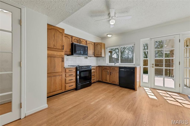 13355 Land O Woods Dr, Saint Louis, MO 63141 - kitchen featuring black appliances, a textured ceiling, brown cabinetry, a ceiling fan, and backsplash
