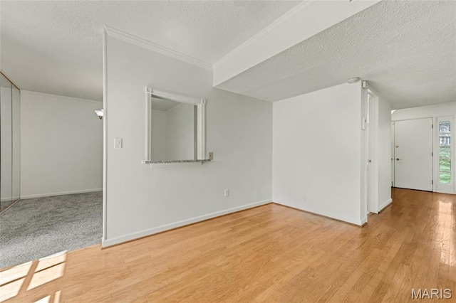 13355 Land O Woods Dr, Saint Louis, MO 63141 - spare room with a textured ceiling, wood finished floors, baseboards, and ornamental molding