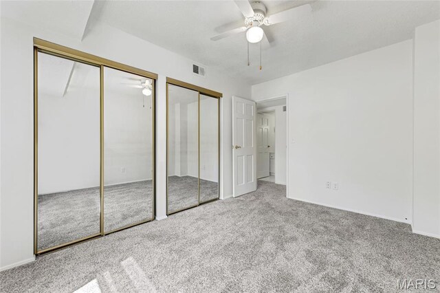 13355 Land O Woods Dr, Saint Louis, MO 63141 - unfurnished bedroom featuring multiple closets, carpet floors, ceiling fan, and baseboards