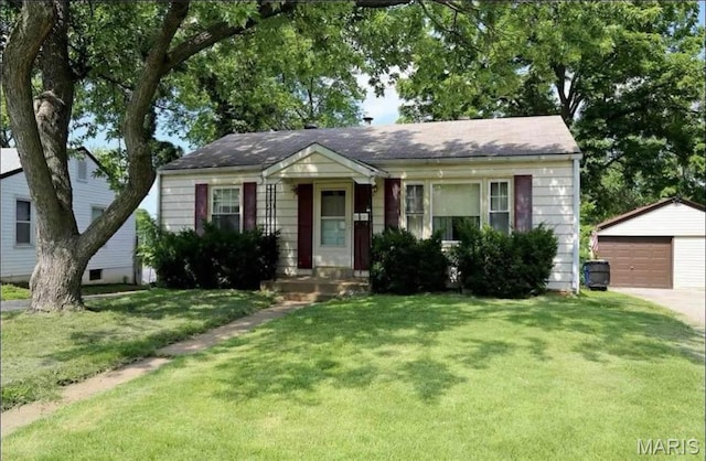 9647 Margo Ann Ln, Saint Louis, MO 63134 - view of front of house with an outdoor structure, a garage, and a front lawn