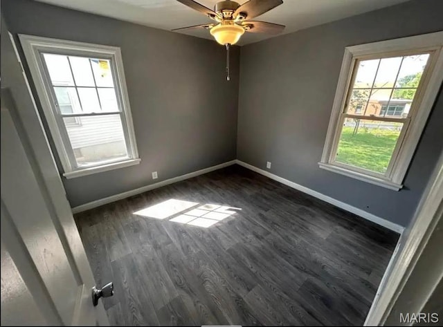 9647 Margo Ann Ln, Saint Louis, MO 63134 - empty room featuring dark wood finished floors, baseboards, and a ceiling fan