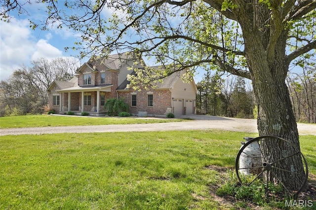 9336 Excelsior Rd, Gerald, MO 63037 - view of front of home featuring brick siding, a garage, covered porch, a front yard, and driveway