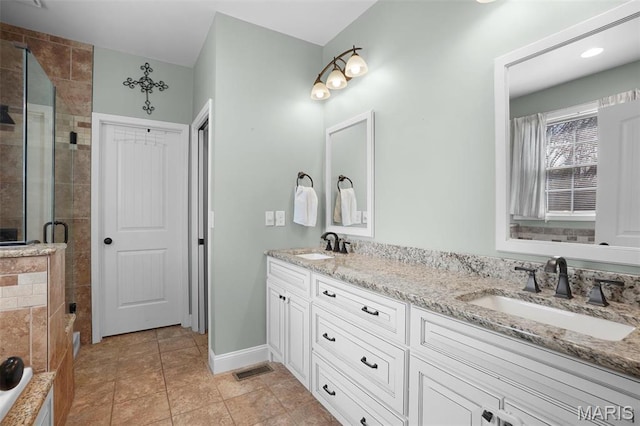 9336 Excelsior Rd, Gerald, MO 63037 - full bath featuring a shower stall, double vanity, baseboards, and tile patterned floors