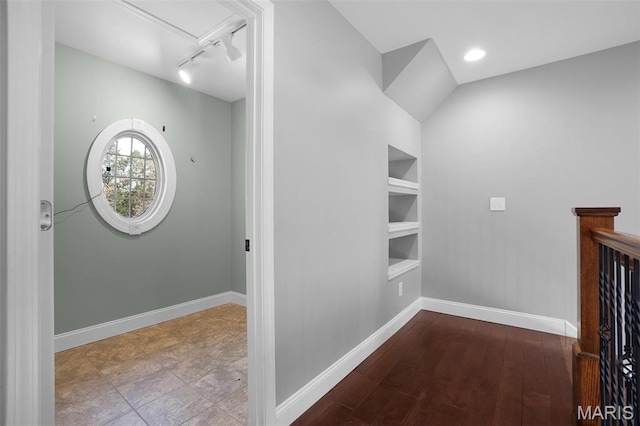 9336 Excelsior Rd, Gerald, MO 63037 - hall with track lighting, built in shelves, baseboards, attic access, and wood finished floors