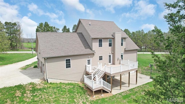 9336 Excelsior Rd, Gerald, MO 63037 - rear view of house with a wooden deck, a shingled roof, a lawn, and stairs