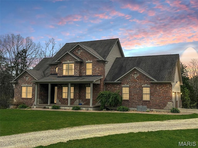 9336 Excelsior Rd, Gerald, MO 63037 - view of front of home with a porch, brick siding, a yard, a garage, and driveway