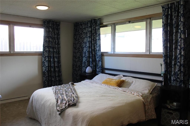 carpeted bedroom featuring baseboards