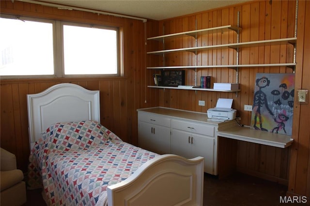 bedroom featuring wooden walls