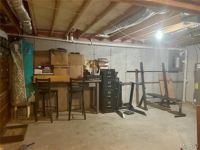 unfinished below grade area featuring water heater
