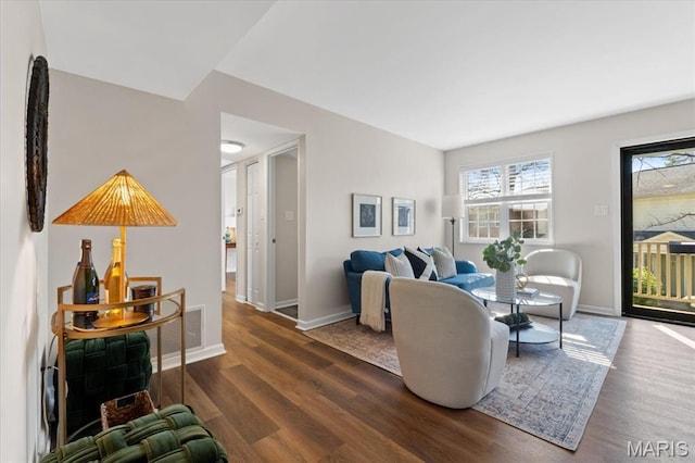 1551 Swallow Dr, Saint Louis, MO 63144 - living area featuring wood finished floors and baseboards