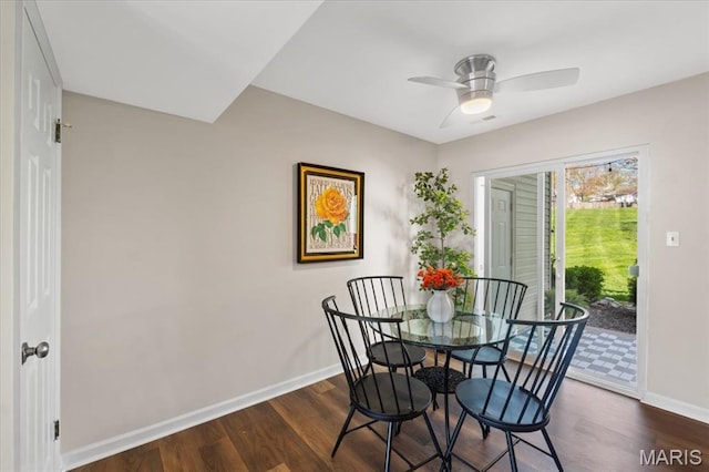 1551 Swallow Dr, Saint Louis, MO 63144 - dining area with baseboards, dark wood-style flooring, and a ceiling fan