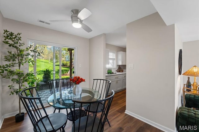 1551 Swallow Dr, Saint Louis, MO 63144 - dining space with healthy amount of natural light, dark wood-style floors, and ceiling fan