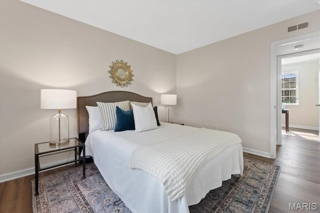 1551 Swallow Dr, Saint Louis, MO 63144 - bedroom featuring wood finished floors and baseboards