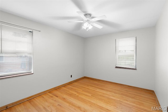 8900 Southview Ln, Saint Louis, MO 63123 - unfurnished room featuring light wood-type flooring, baseboards, and a ceiling fan