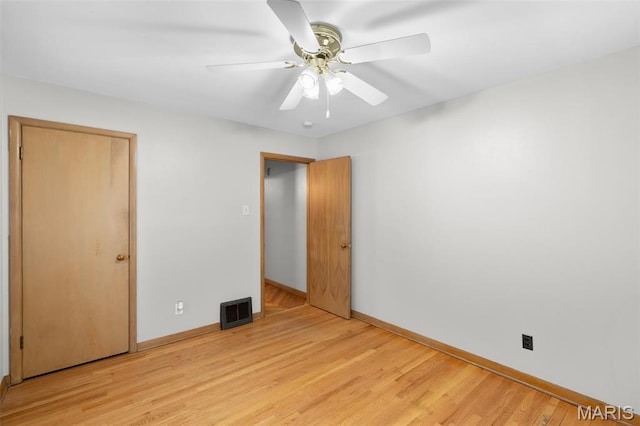 8900 Southview Ln, Saint Louis, MO 63123 - unfurnished bedroom featuring baseboards, light wood finished floors, and ceiling fan