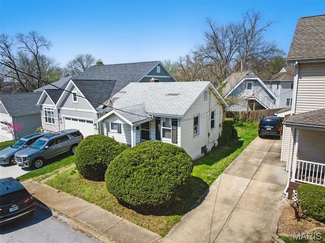 329 Mccullough Ave, Saint Louis, MO 63122 - view of front of house featuring driveway, a residential view, fence, and roof with shingles
