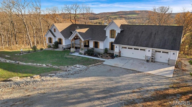 24925 State Route Mm, Farmington, MO 63640 - view of front of house with concrete driveway, a front yard, and an attached garage