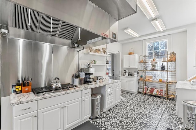876 W State St W, Jacksonville, IL 62650 - kitchen with extractor fan, white cabinetry, open shelves, and stainless steel gas cooktop
