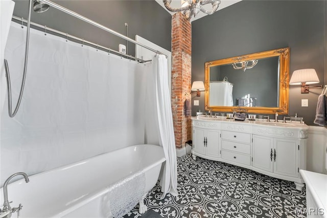876 W State St W, Jacksonville, IL 62650 - bathroom with a soaking tub, double vanity, a chandelier, brick wall, and a shower with curtain