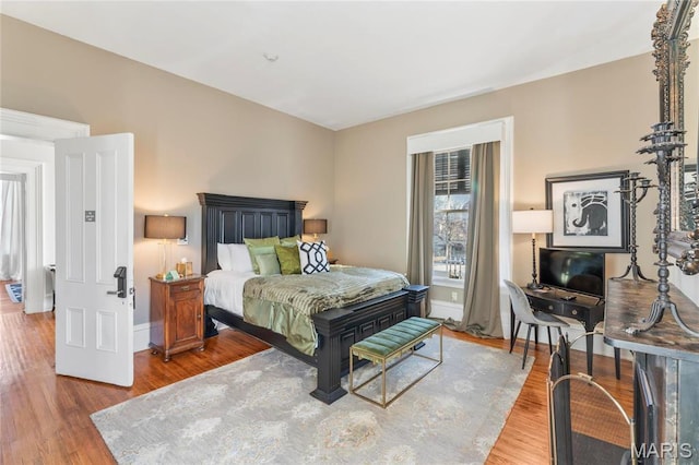876 W State St W, Jacksonville, IL 62650 - bedroom featuring wood finished floors and baseboards
