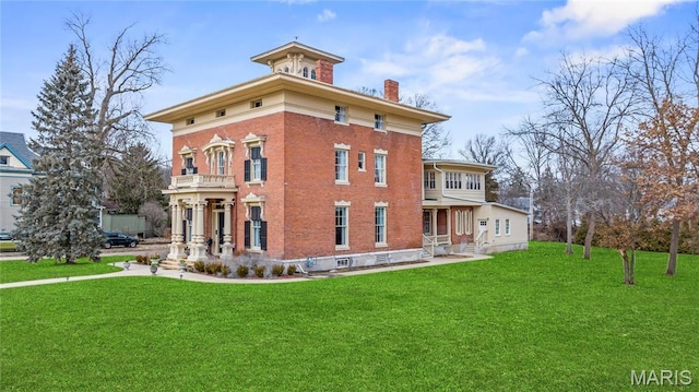 876 W State St W, Jacksonville, IL 62650 - view of property exterior with a chimney, a lawn, and brick siding
