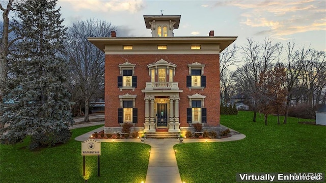876 W State St W, Jacksonville, IL 62650 - italianate home featuring a chimney, a front lawn, and brick siding