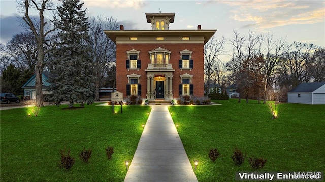 876 W State St W, Jacksonville, IL 62650 - italianate house with a front yard, brick siding, and a chimney