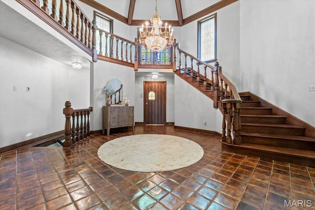 13596 Kings Glen Dr, Saint Louis, MO 63131 - entrance foyer featuring a towering ceiling, a chandelier, baseboards, and stairs