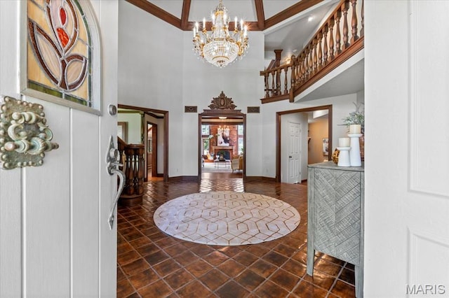 13596 Kings Glen Dr, Saint Louis, MO 63131 - entryway with a chandelier, a high ceiling, tile patterned flooring, and baseboards
