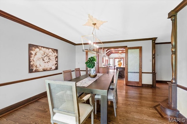 13596 Kings Glen Dr, Saint Louis, MO 63131 - dining area featuring a chandelier, ornamental molding, wood finished floors, and baseboards
