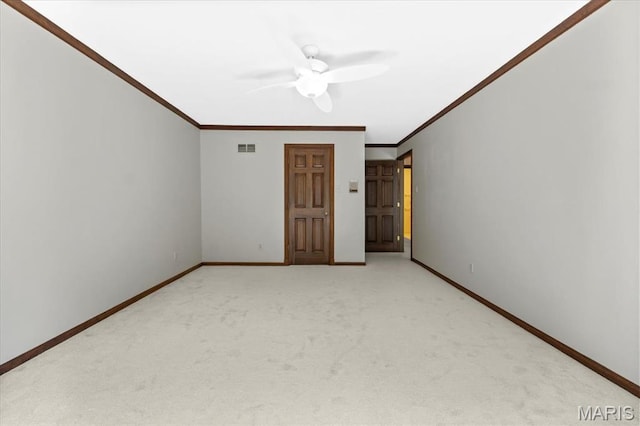 13596 Kings Glen Dr, Saint Louis, MO 63131 - empty room featuring ornamental molding, light carpet, a ceiling fan, and baseboards