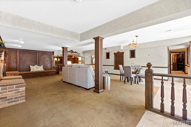 13596 Kings Glen Dr, Saint Louis, MO 63131 - living room with decorative columns and light colored carpet