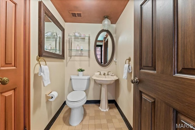 13596 Kings Glen Dr, Saint Louis, MO 63131 - bathroom with baseboards, toilet, tile patterned floors, and a sink